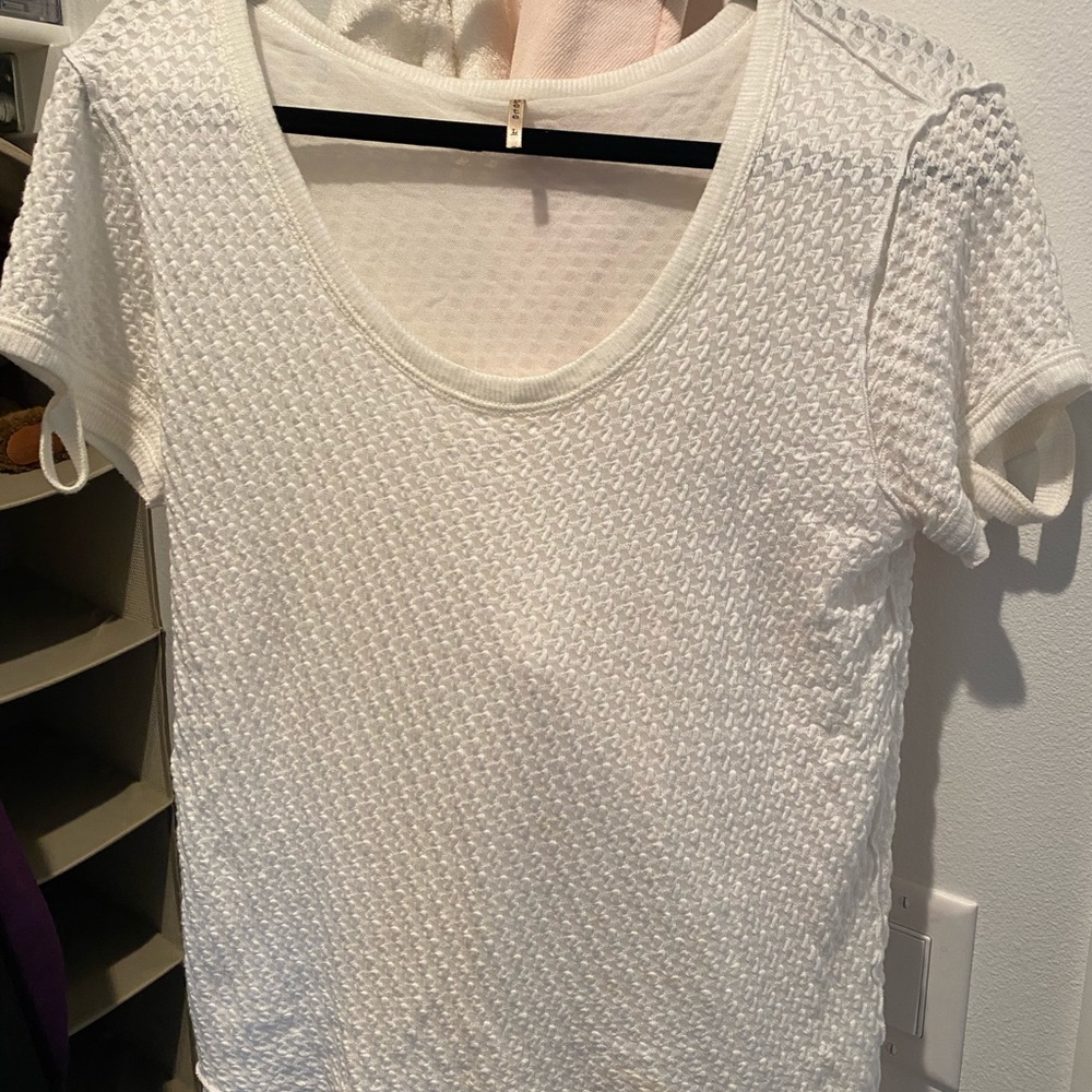 Cream colored Pete brand short sleeve tshirt.